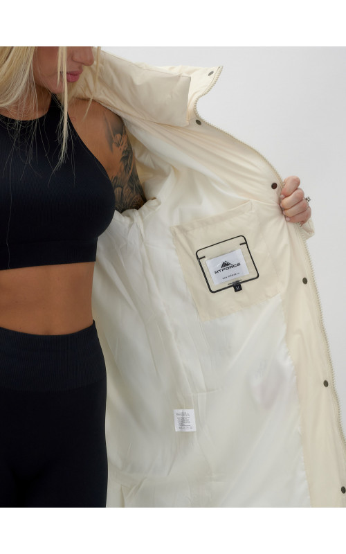 Тёплый женский пуховик с капюшоном до колена.